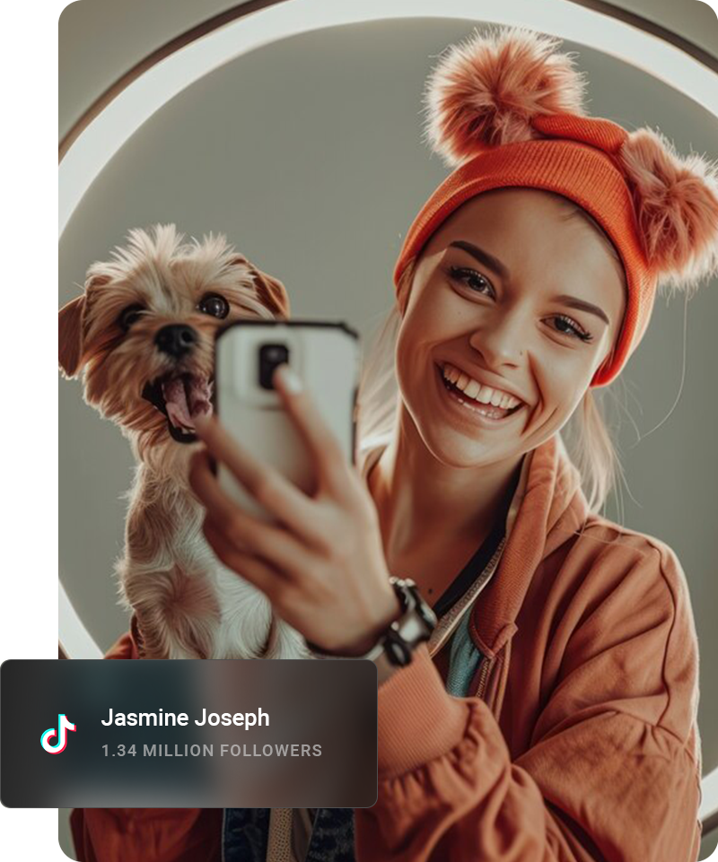 Youtube influencer looking away from the camera and smiling while sitting on a curb.